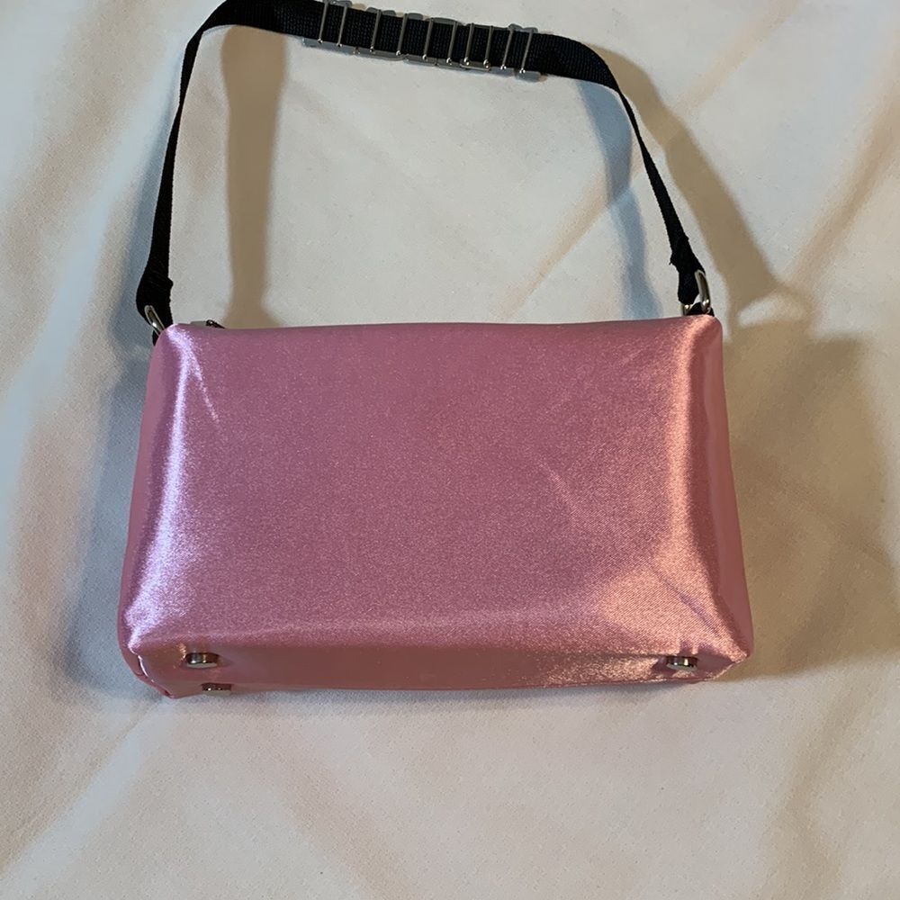Truly small handbag/clutch.  Pink satin with rhinestone letters on black strap